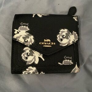 Coach trifold wallet with black floral print